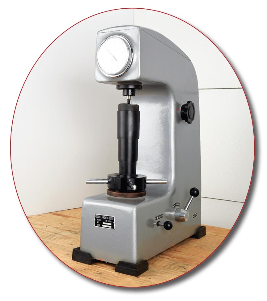 This standard Rockwell hardness tester weighs 143 pounds. It comes with various penetrators, anvils, force inputs and sample materials for checking calibration.